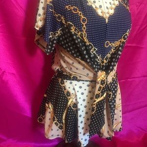 Faith and Joy size medium top stretchy material with tie in middle.